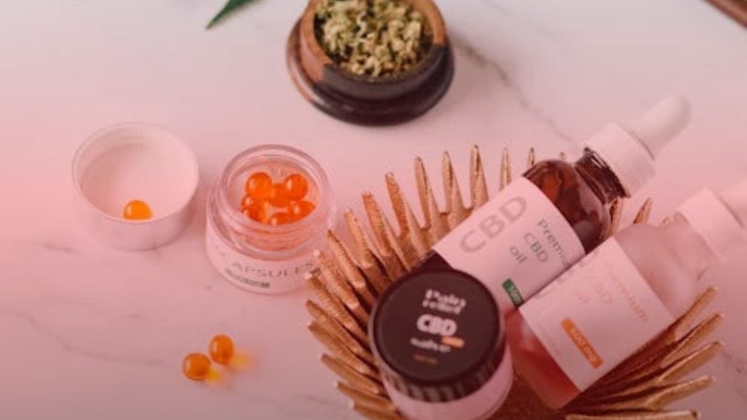 Nature's Canopy House Select cannabis CBD products, including capsules, oils, and creams, are elegantly displayed on a marble surface alongside a small dish of dried herbs. Dispensary In Mississauga