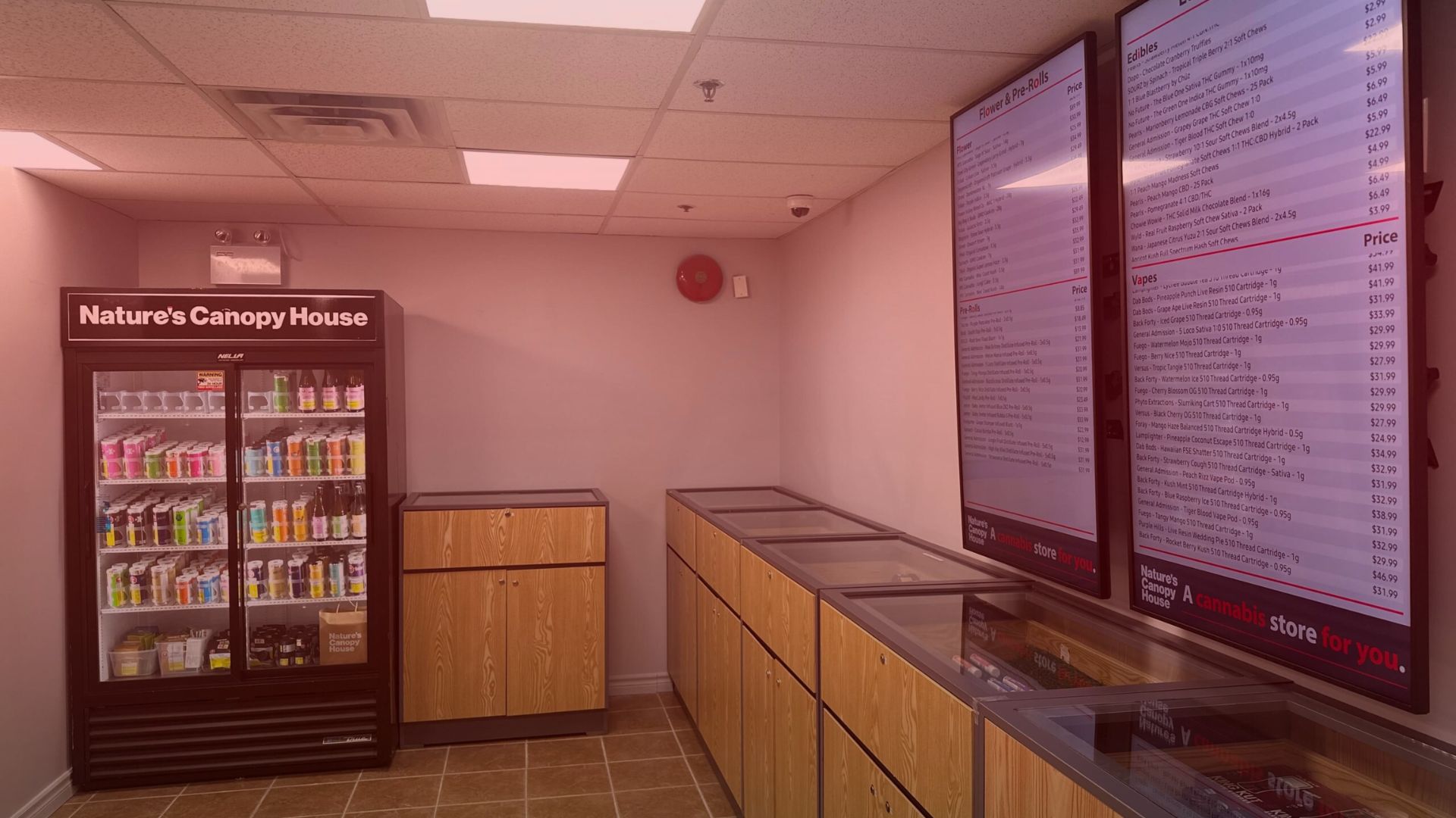 Nature's Canopy House A store interior with a refrigerated beverage display, wooden counters, and digital menus on the wall. Dispensary In Mississauga